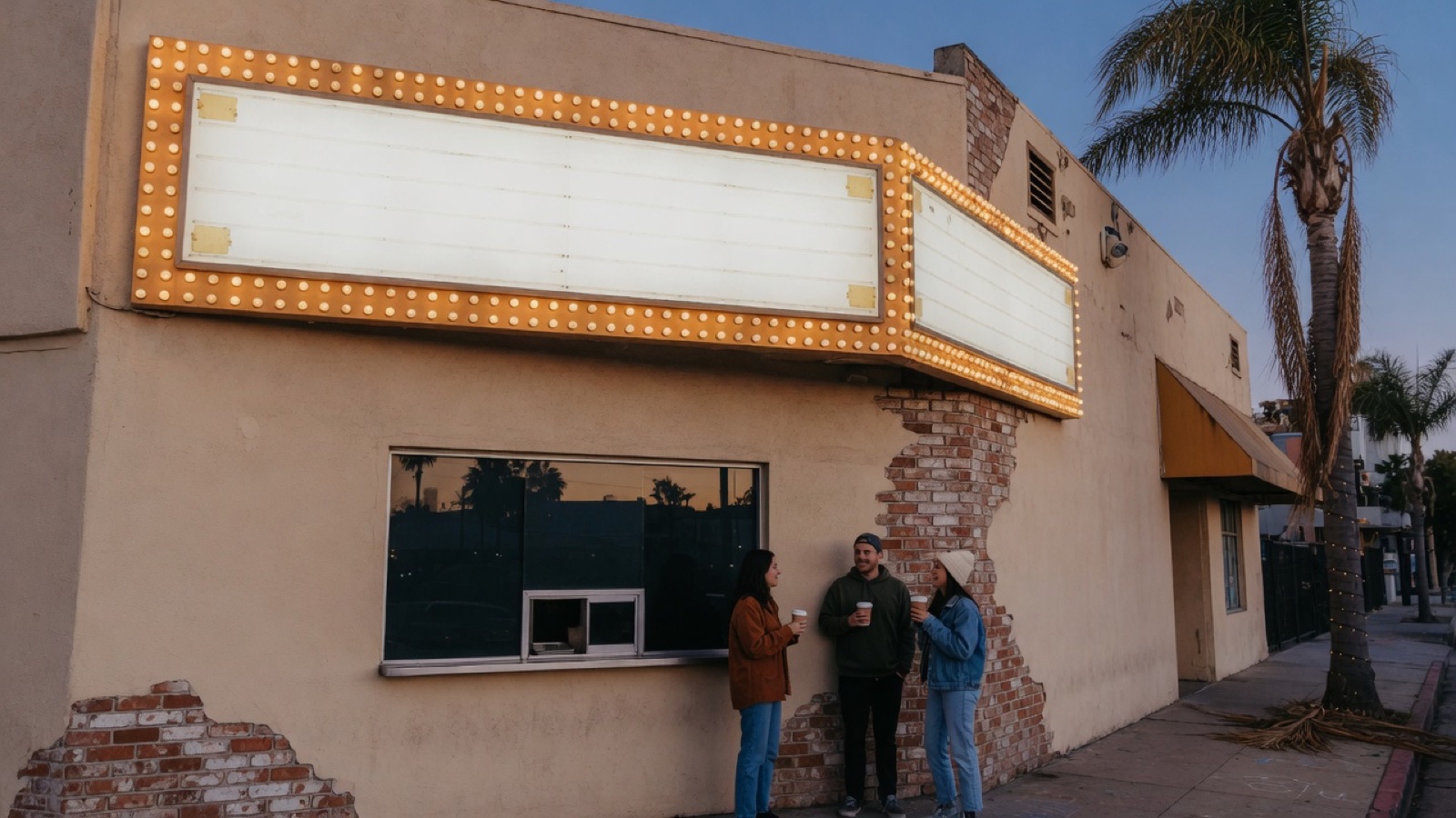 Cinema exterior neon dusk Los Angeles